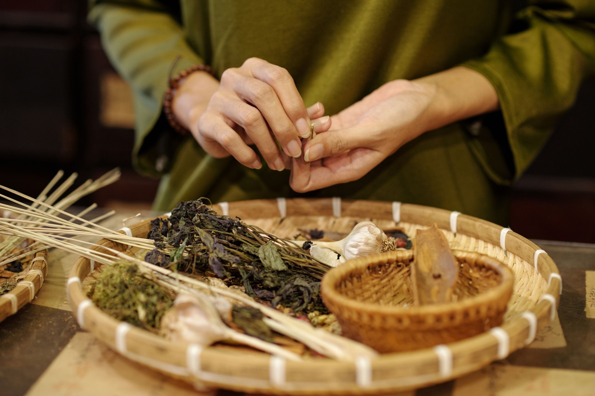 Pharmacist Choosing Herbs For Traditional Chinese Treatment